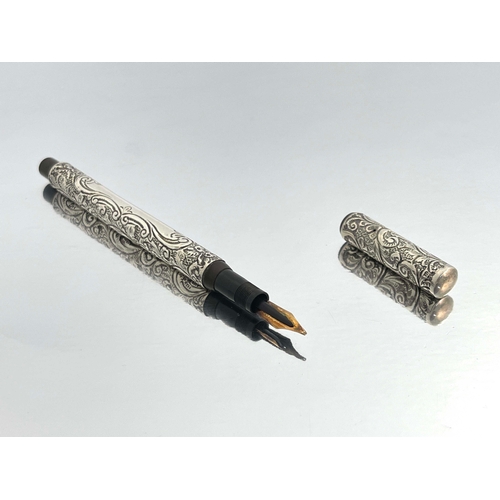 320 - James W Queen and Co., Philadelphia, a silver Number 4 fountain pen, 1905, embossed and chased folia... 