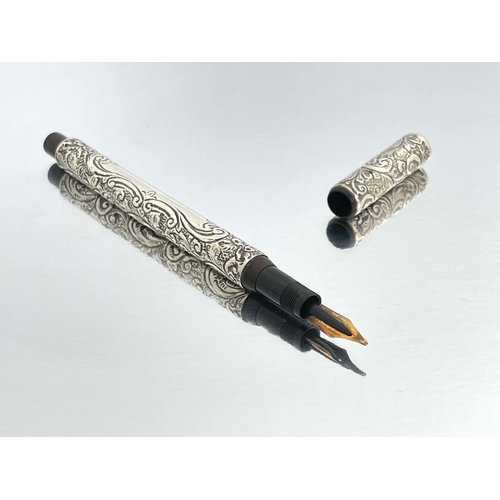 320 - James W Queen and Co., Philadelphia, a silver Number 4 fountain pen, 1905, embossed and chased folia... 