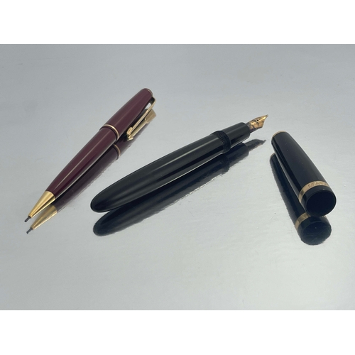 321 - Parker, a Duofold fountain pen, circa 1953, black with gold trim, the 14 carat gold nib stamped 25, ... 