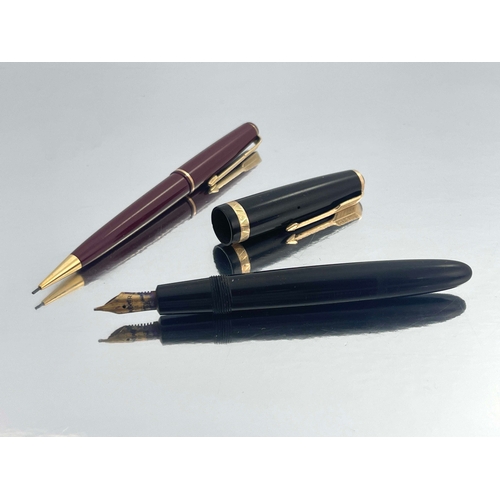 321 - Parker, a Duofold fountain pen, circa 1953, black with gold trim, the 14 carat gold nib stamped 25, ... 