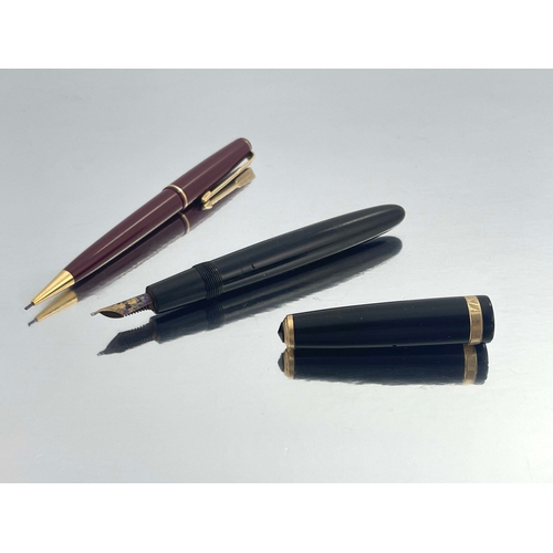 321 - Parker, a Duofold fountain pen, circa 1953, black with gold trim, the 14 carat gold nib stamped 25, ... 