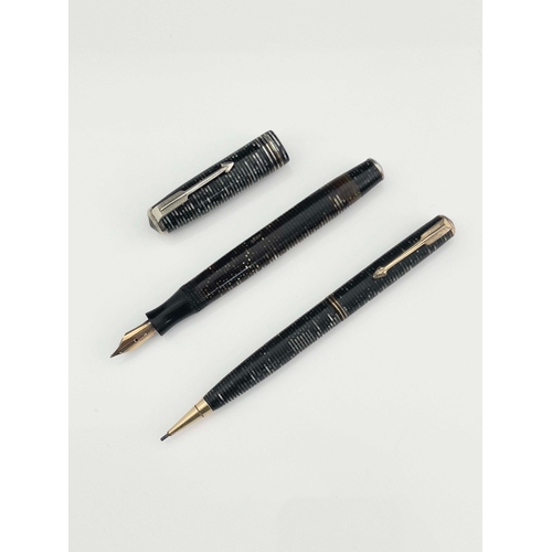 322 - Parker, a Vacumatic fountain pen and pencil, circa 1944, laminated Grey Pearl iridescent stripe, chr... 