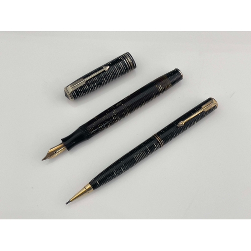 322 - Parker, a Vacumatic fountain pen and pencil, circa 1944, laminated Grey Pearl iridescent stripe, chr... 