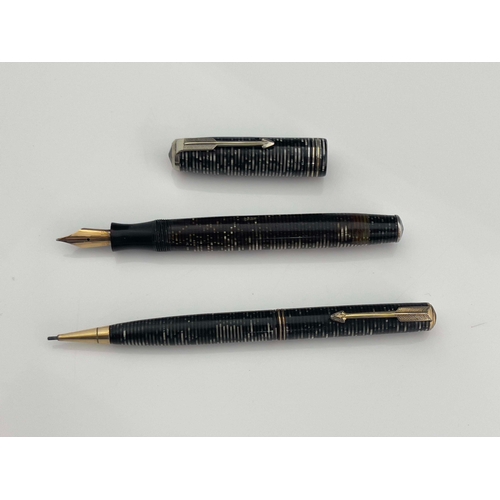 322 - Parker, a Vacumatic fountain pen and pencil, circa 1944, laminated Grey Pearl iridescent stripe, chr... 