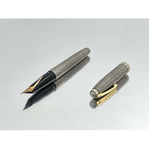 323 - Sheaffer, a silver Imperial Sovereign fountain pen, circa 1990, diamond pattern, sterling silver, wi... 