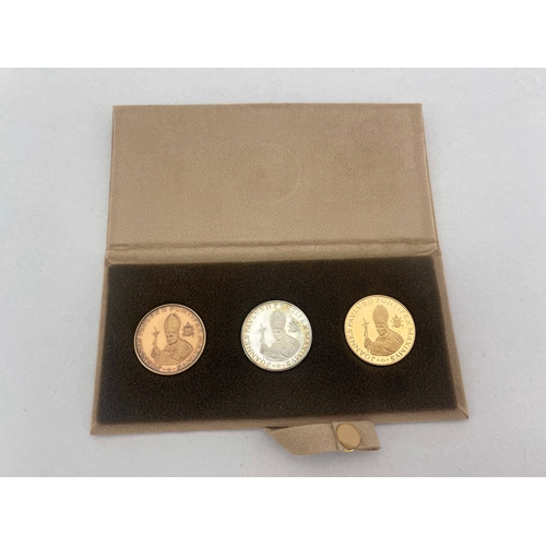 355 - Vatican City, Millennium 2000 18ct gold, silver and bronze 3-coin set of Pope John Paul II, in the s... 