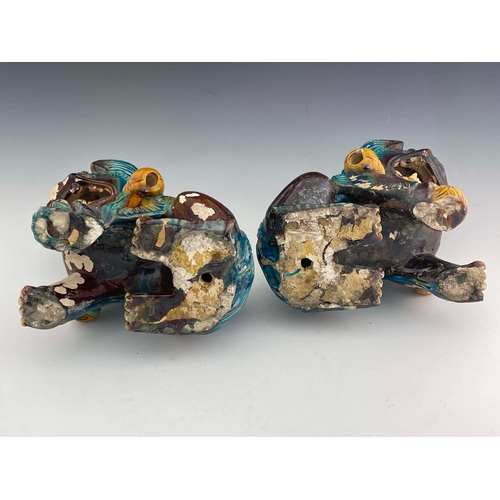 360 - A large pair of Chinese tang glazed foo dogs, circa 1880, modelled sitting, one with paw resting on ... 