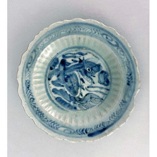 362 - Four Oriental blue and white dishes and plates, including relief moulded lotus dish, 17th century an... 