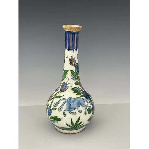 368 - A Persian bottle vase, 19th Century, extended neck, bulbous body, painted with wild animals amongst ... 