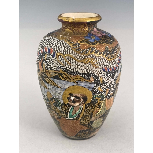 375 - A Japanese satsuma ware baluster vase, Meiji period, 1868-1912, profusely decorated with raised enam... 