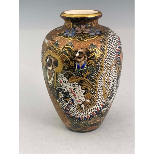 375 - A Japanese satsuma ware baluster vase, Meiji period, 1868-1912, profusely decorated with raised enam... 