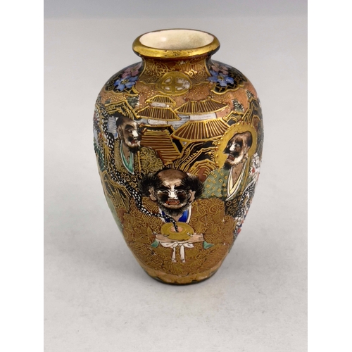 375 - A Japanese satsuma ware baluster vase, Meiji period, 1868-1912, profusely decorated with raised enam... 