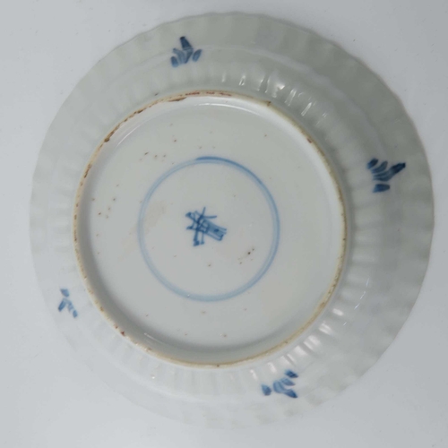 382 - A pair of Chinese blue and white ribbed moulded saucers, kangxi, each painted with a central crab wi... 