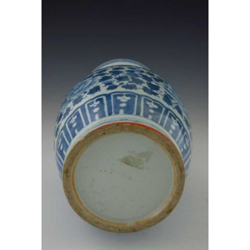 389 - A 19th Century Chinese provincial blue and white baluster vase, two-dimensional beast handles, the b... 