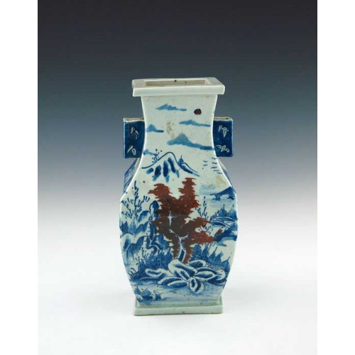 393 - A Chinese provincial blue and white baluster vase, 19th Century, of rectangular section with angular... 