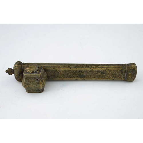 404 - An Islamic brass scribe's inkwell, incorporating quill holder, 23cm long