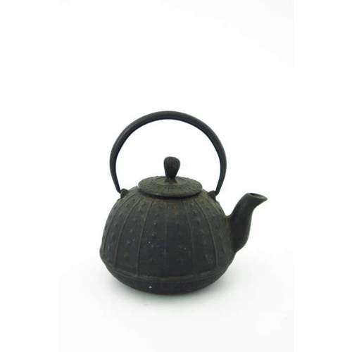 409 - A Japanese cast iron tea pot, 19th Century, of lobed ovoid form, loop handle, cast two character mar... 