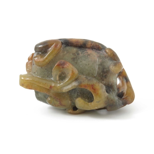 416 - A Chinese jade carving, in the form of a kylin on a rock, russet inclusions, 4.5cm