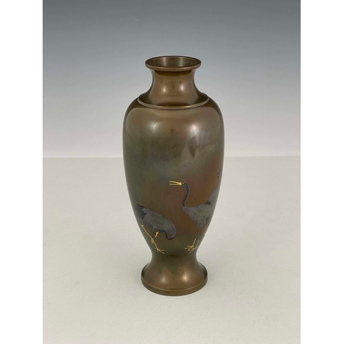 419 - A Japanese inlaid bi-metal bronze vase, Meiji period, 1868-1912. of slender baluster form with a tri... 