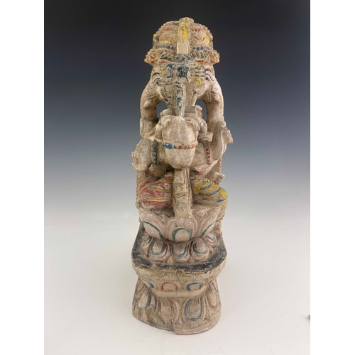 426 - An Indian carved figure of Ganesha, painted in multiple colours on white ground, 38cm high