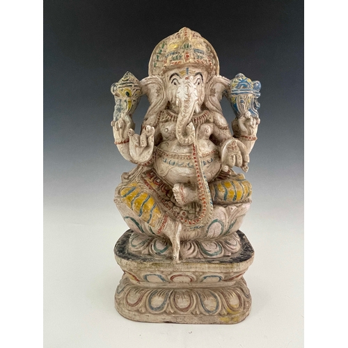 426 - An Indian carved figure of Ganesha, painted in multiple colours on white ground, 38cm high