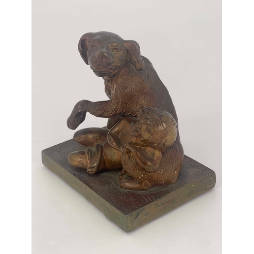 444 - A Victorian bronze figure group, modelled as a dog protecting a child, raised on rectangular wood an... 