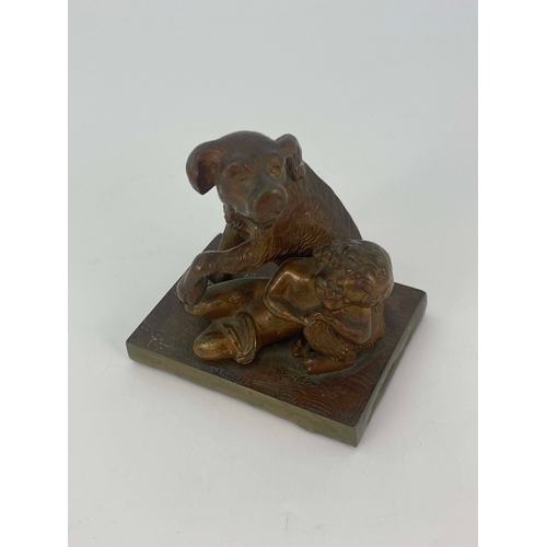 444 - A Victorian bronze figure group, modelled as a dog protecting a child, raised on rectangular wood an... 