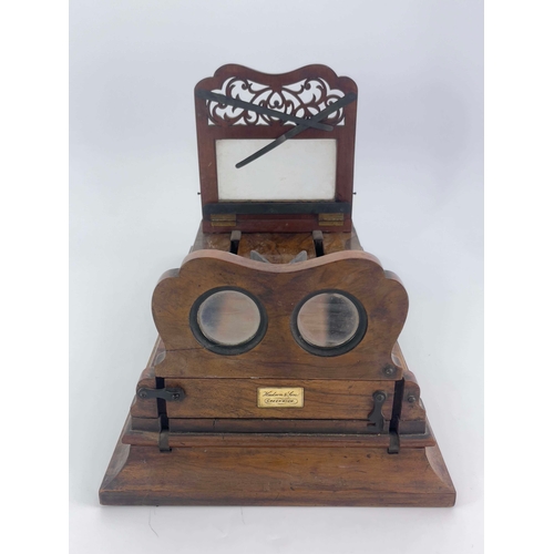 458 - A 19th Century Hudson & Son of Greenwich figured walnut table top stereoscopic viewer, height adjust... 