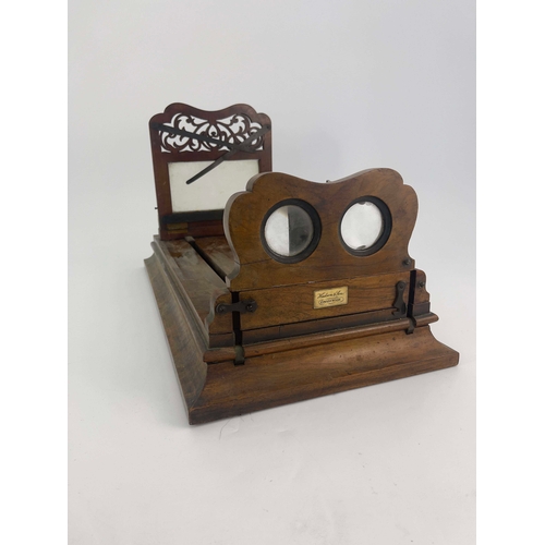 458 - A 19th Century Hudson & Son of Greenwich figured walnut table top stereoscopic viewer, height adjust... 