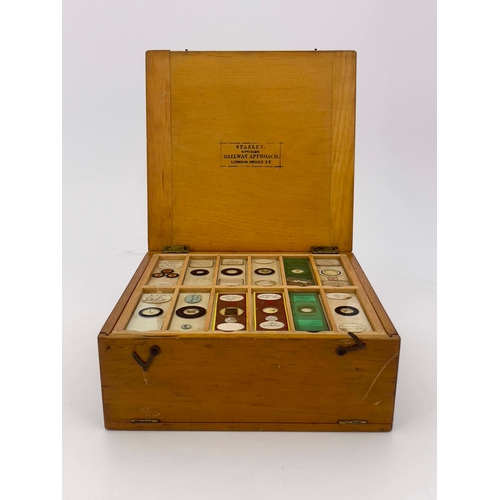 468 - Two wooden boxes of laboratory glass specimen slides, labels written and printed to include those by... 