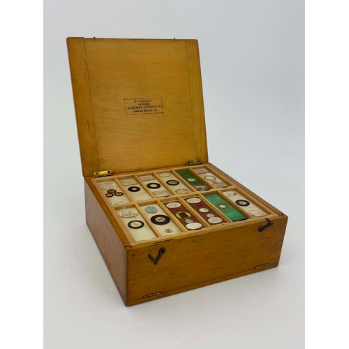 468 - Two wooden boxes of laboratory glass specimen slides, labels written and printed to include those by... 