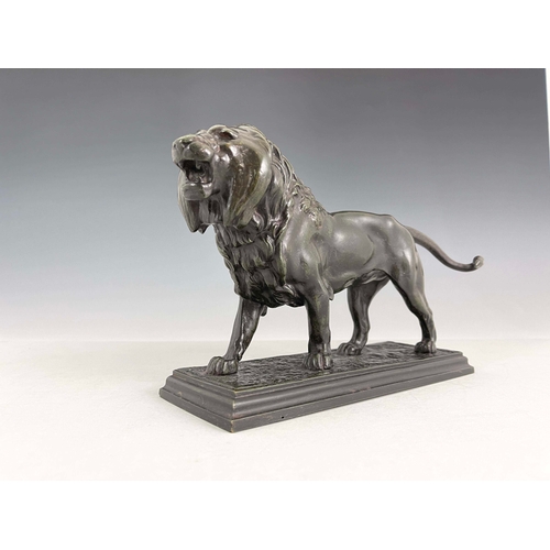 471 - After Alfred  Bayre, bronze model of a standing lion in profile, signed, mounted on a rectangular pl... 