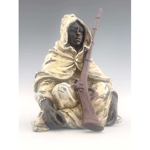 493 - Franz Bergman (Austrian, 1838-1894), a seated Arab holding a rifle, cold painted metal, stamped urn ... 