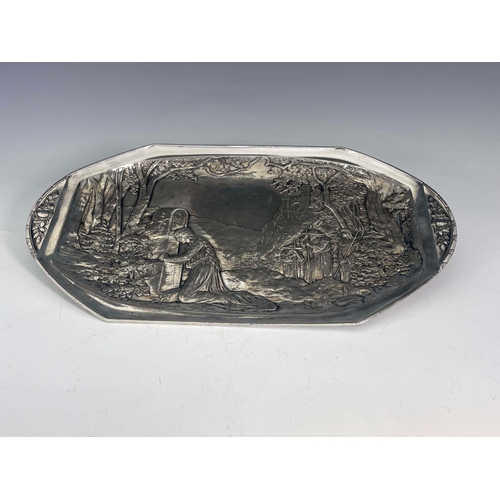 503 - WMF, a Jugendstil silver plated card tray, model 11782, repousse decorated with a mountainous woodla... 