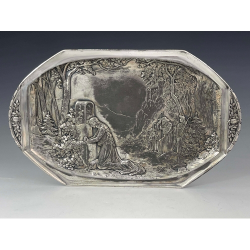 503 - WMF, a Jugendstil silver plated card tray, model 11782, repousse decorated with a mountainous woodla... 