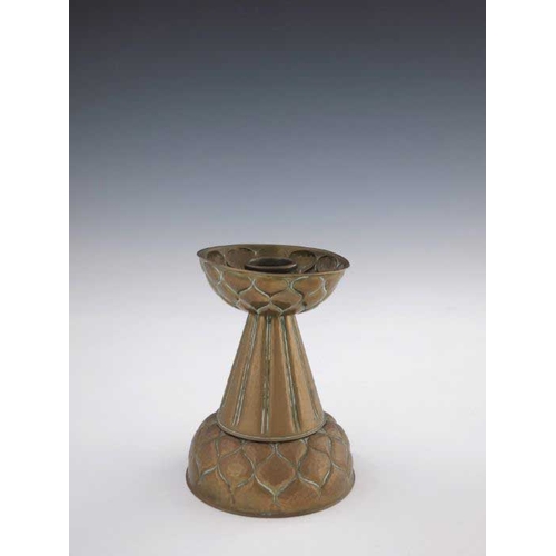 505 - Ignatius Taschner, a Jugendstil brass candlestick, circa 1905, the ribbed conical body with embossed... 