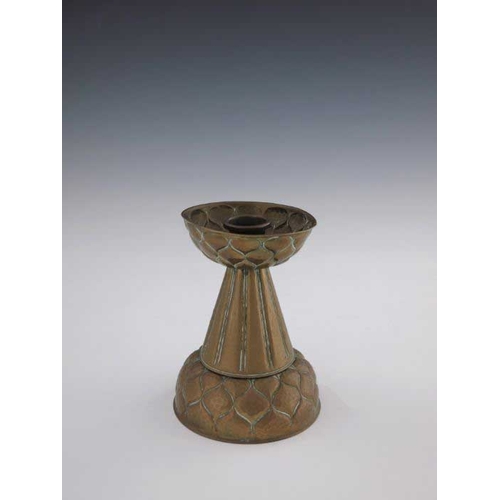 505 - Ignatius Taschner, a Jugendstil brass candlestick, circa 1905, the ribbed conical body with embossed... 