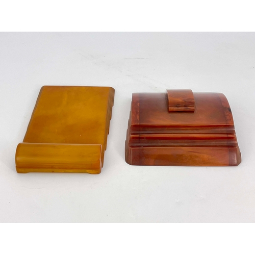 515 - An Art Deco Carvercraft Bakelite inkwell and notepad holder, amber effect, stepped and fanned design... 