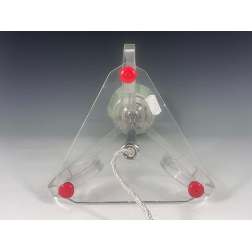 519 - An Art Deco lucite table lamp, three scroll end bracket supports, on triangular base