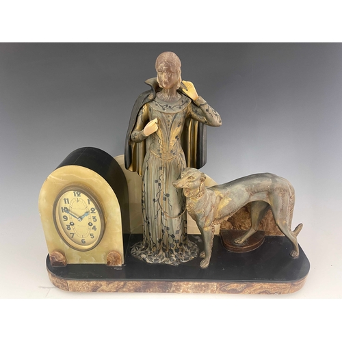 520 - Menneville et Rochard, a large Art Deco figural clock, modelled with a woman and saluki dog, on marb... 