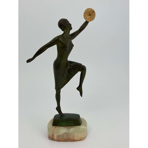 532 - Georges Vacossin, Woman with Cymbals, an Art Deco bronze figure, circa 1930, modelled with knee rais... 