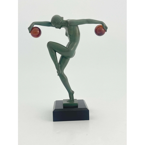 533 - Marcel Bouraine for Max Le Verrier, Danseuse au Boules, a green patinated art metal figure, circa 19... 