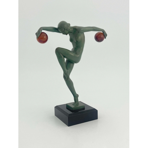 533 - Marcel Bouraine for Max Le Verrier, Danseuse au Boules, a green patinated art metal figure, circa 19... 