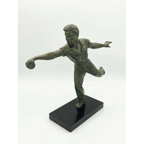 542 - Jean de Roncourt, Petanque Player, a green patinated art metal figure, circa 1930, modelled bowling ... 