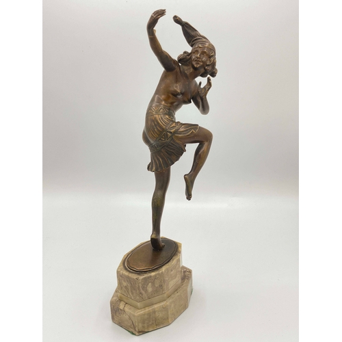 544 - Otto Poertzel, Dancing Woman with Jester, an Art Deco patinated bronze figure, circa 1925, modelled ... 