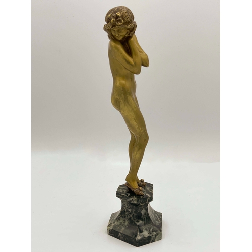 546 - Claire Colinet, Darling, an Art Deco gilt bronze figure, circa 1925, modelled as a nude woman in sli... 