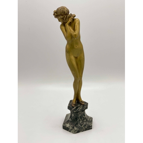 546 - Claire Colinet, Darling, an Art Deco gilt bronze figure, circa 1925, modelled as a nude woman in sli... 