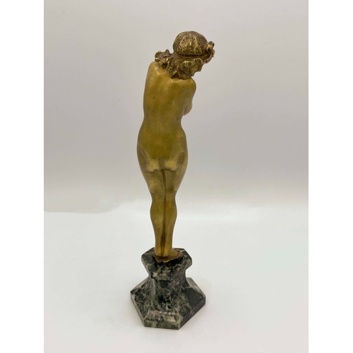 546 - Claire Colinet, Darling, an Art Deco gilt bronze figure, circa 1925, modelled as a nude woman in sli... 