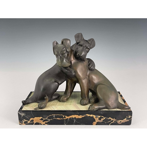 557 - Irenee Rochard, an Art Deco patinated art metal figure group, circa 1925, modelled as two dogs embra... 