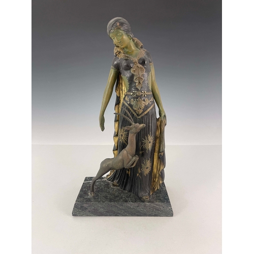 558 - Georges Van Der Voorde, an Art Deco patinated art metal figure group, circa 1925, modelled as a woma... 